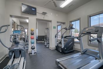 Sophisticated Fitness Center with Exercise Bikes and Free Weights